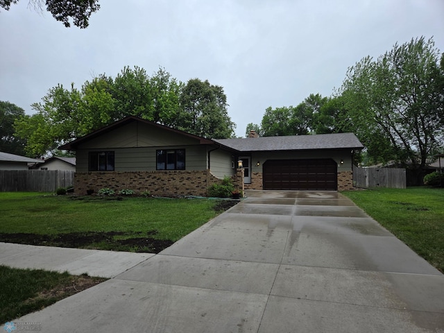 37 36th Ave NE, Fargo, ND 58102 - ranch-style home featuring a garage, driveway, brick siding, and a chimney
