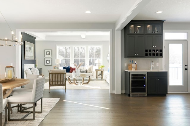 6501 Timber Arch Dr, Chaska, MN 55318 - indoor wet bar with wine cooler, healthy amount of natural light, dark wood-type flooring, and recessed lighting