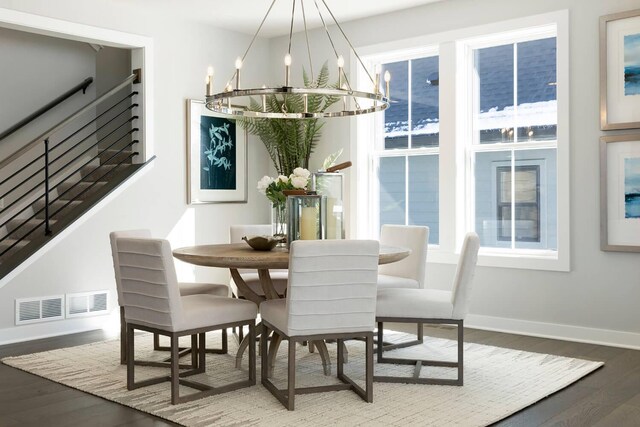 6501 Timber Arch Dr, Chaska, MN 55318 - dining area with a chandelier, wood finished floors, baseboards, and stairway