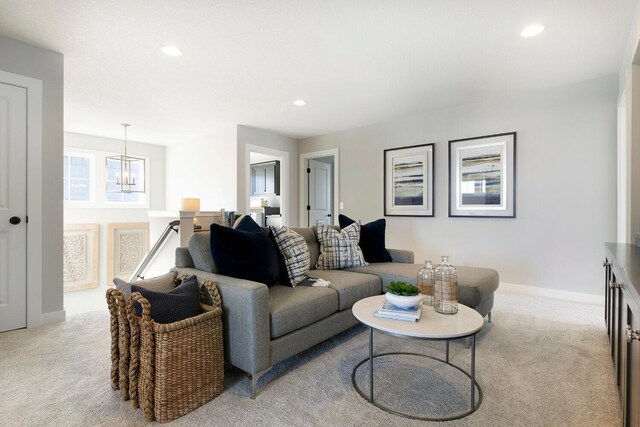 6501 Timber Arch Dr, Chaska, MN 55318 - carpeted living room with a chandelier, recessed lighting, and baseboards