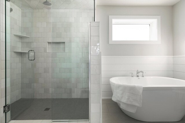 6501 Timber Arch Dr, Chaska, MN 55318 - full bath featuring a shower stall, a soaking tub, and wainscoting