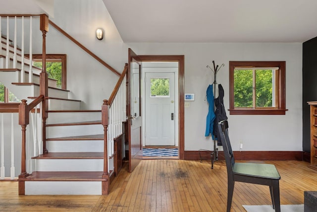 3015 22nd St, Minneapolis, MN 55406 - foyer entrance featuring wood-type flooring, plenty of natural light, and stairway