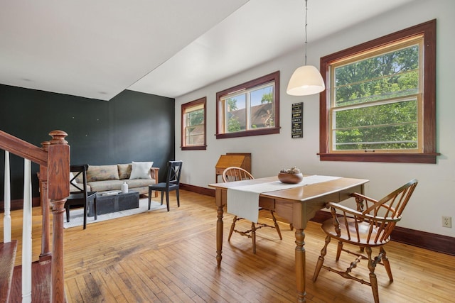 3015 22nd St, Minneapolis, MN 55406 - dining area with light wood-style floors and stairway