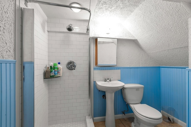 2800 Alabama Ave S, Saint Louis Park, MN 55416 - bathroom with a shower stall, toilet, wainscoting, and tile patterned floors