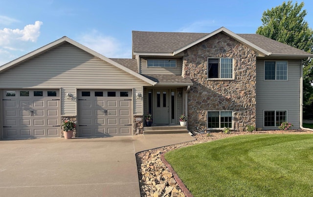 409 Iris Ln NE, Saint Joseph, MN 56374 - view of front of house with stone siding, concrete driveway, an attached garage, a front lawn, and a shingled roof