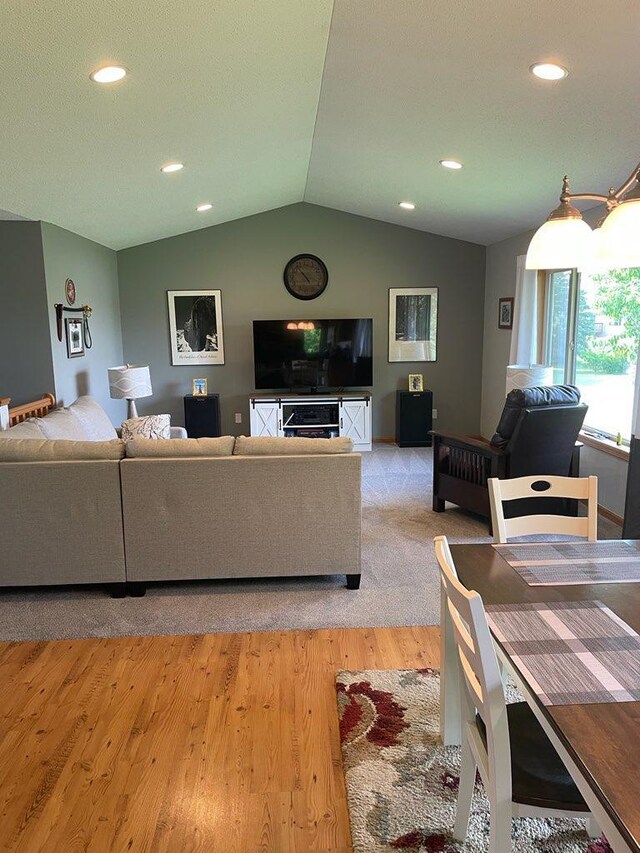 409 Iris Ln NE, Saint Joseph, MN 56374 - living area featuring vaulted ceiling, light wood finished floors, and recessed lighting