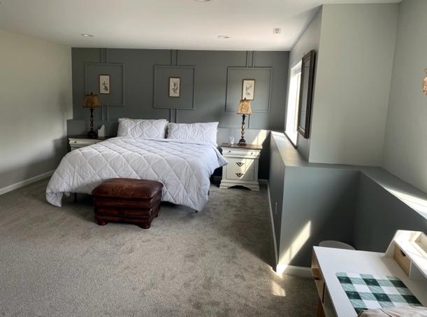 409 Iris Ln NE, Saint Joseph, MN 56374 - carpeted bedroom with baseboards