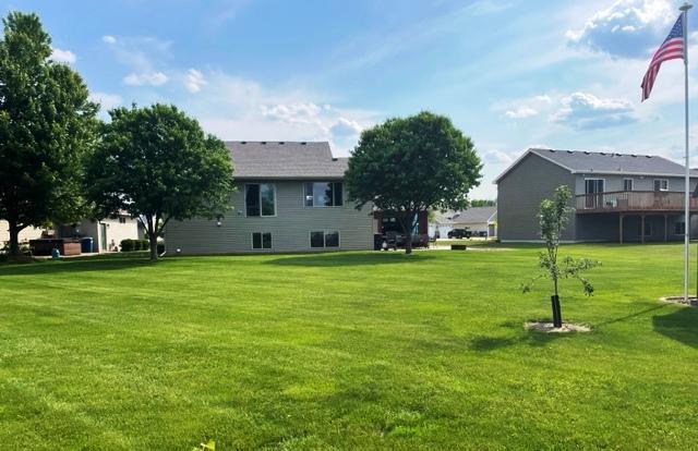 409 Iris Ln NE, Saint Joseph, MN 56374 - view of property's community with a lawn
