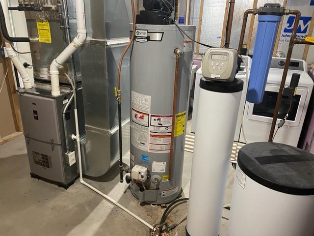 409 Iris Ln NE, Saint Joseph, MN 56374 - utility room featuring water heater