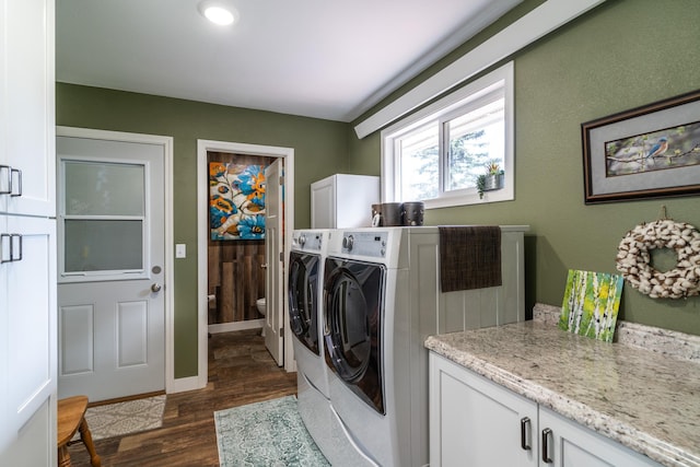 701 Mill St, Fertile, MN 56540 - laundry room with cabinet space, washing machine and clothes dryer, dark wood finished floors, and baseboards