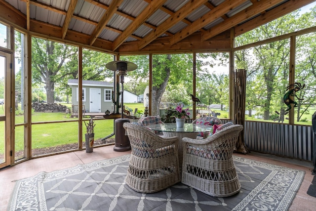 701 Mill St, Fertile, MN 56540 - sunroom with healthy amount of natural light, outdoor dining area, and vaulted ceiling