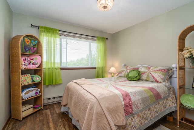701 Mill St, Fertile, MN 56540 - bedroom with baseboard heating and wood finished floors