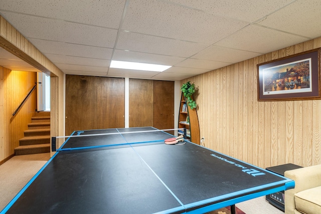 701 Mill St, Fertile, MN 56540 - playroom featuring wood walls, a drop ceiling, and carpet flooring