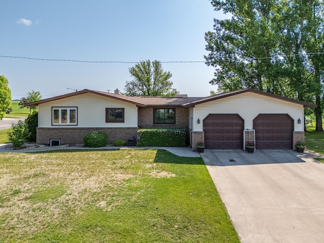 501 Thompson Ave, Fisher, MN 56723 - single story home featuring brick siding, an attached garage, concrete driveway, and a front lawn