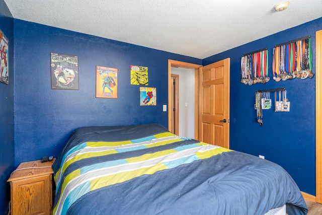 501 Thompson Ave, Fisher, MN 56723 - bedroom with a textured ceiling