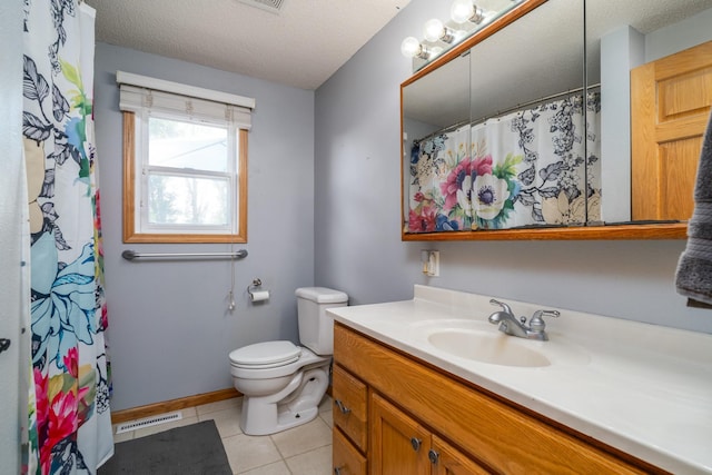 501 Thompson Ave, Fisher, MN 56723 - full bath with vanity, toilet, tile patterned flooring, a textured ceiling, and baseboards