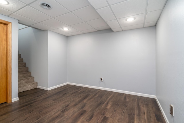501 Thompson Ave, Fisher, MN 56723 - finished basement with baseboards, dark wood finished floors, stairs, a drop ceiling, and recessed lighting
