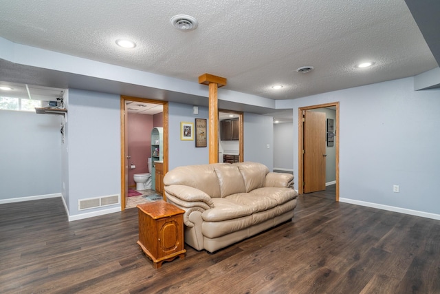 501 Thompson Ave, Fisher, MN 56723 - living area with a textured ceiling, dark wood-type flooring, baseboards, and recessed lighting
