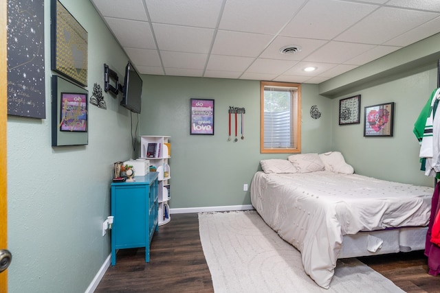 501 Thompson Ave, Fisher, MN 56723 - bedroom with wood finished floors, baseboards, and a drop ceiling
