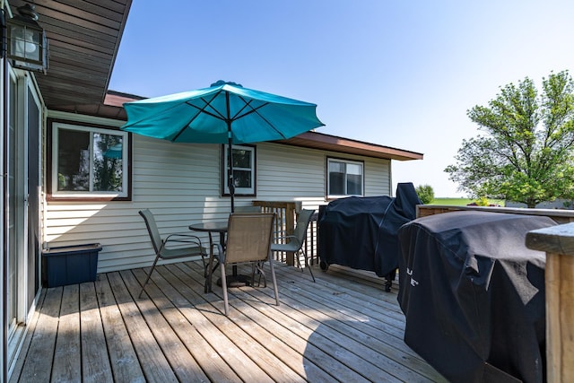 501 Thompson Ave, Fisher, MN 56723 - deck featuring outdoor dining space and a grill