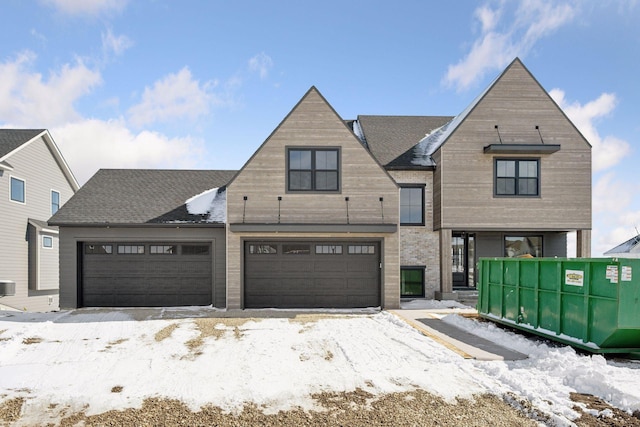 10154 Peony Ln N, Maple Grove, MN 55311 - view of front facade featuring central AC unit, driveway, and an attached garage