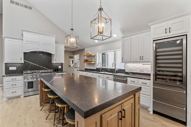 6141 Sherman Cir, Edina, MN 55436 - kitchen with stainless steel appliances, beverage cooler, open shelves, light wood-type flooring, and dark countertops