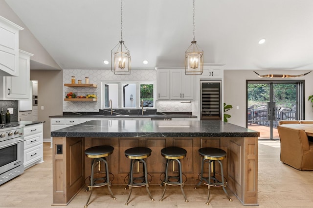 6141 Sherman Cir, Edina, MN 55436 - kitchen featuring beverage cooler, high end stove, open shelves, tasteful backsplash, and white cabinetry