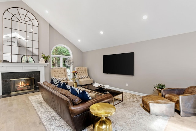 6141 Sherman Cir, Edina, MN 55436 - living area with wood finished floors, a high end fireplace, recessed lighting, and high vaulted ceiling