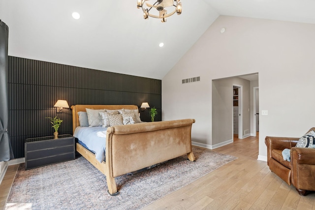 6141 Sherman Cir, Edina, MN 55436 - bedroom with light wood-style flooring, high vaulted ceiling, a chandelier, and recessed lighting