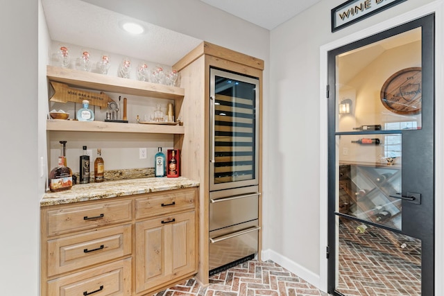 6141 Sherman Cir, Edina, MN 55436 - indoor dry bar featuring brick flooring and baseboards