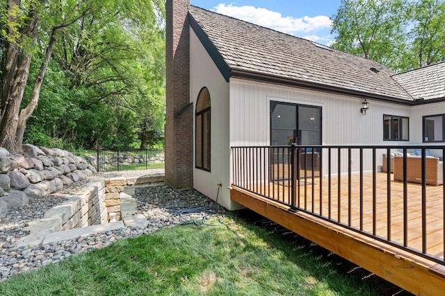 6141 Sherman Cir, Edina, MN 55436 - view of home's exterior featuring a chimney and a deck
