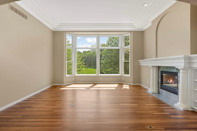 1540 Waterford Ct, Golden Valley, MN 55422 - unfurnished living room featuring crown molding, wood finished floors, a high end fireplace, baseboards, and a raised ceiling