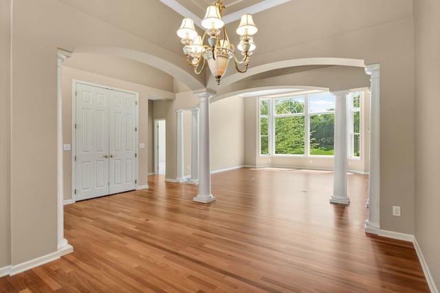 1540 Waterford Ct, Golden Valley, MN 55422 - spare room with arched walkways, wood finished floors, decorative columns, and baseboards