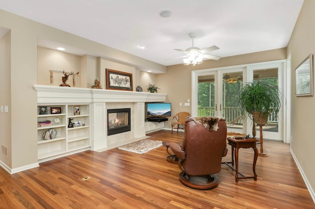 1540 Waterford Ct, Golden Valley, MN 55422 - living area with wood finished floors, a fireplace, ceiling fan, and baseboards