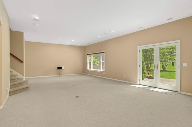 1540 Waterford Ct, Golden Valley, MN 55422 - unfurnished living room featuring baseboards, carpet flooring, french doors, stairway, and recessed lighting