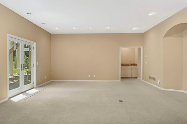 1540 Waterford Ct, Golden Valley, MN 55422 - spare room with light colored carpet, baseboards, and a smoke detector