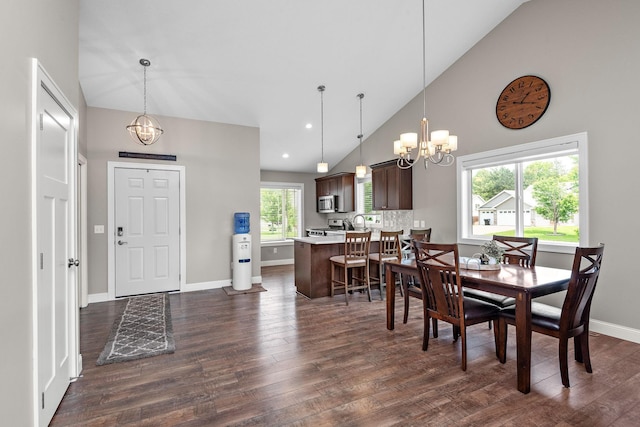 17051 Lupine Ln, Big Lake, MN 55309 - dining space with a chandelier, dark wood finished floors, baseboards, recessed lighting, and high vaulted ceiling