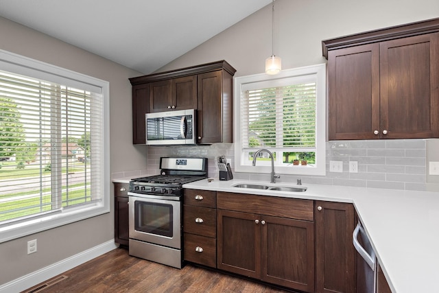 17051 Lupine Ln, Big Lake, MN 55309 - kitchen with stainless steel appliances, a sink, decorative backsplash, plenty of natural light, and vaulted ceiling