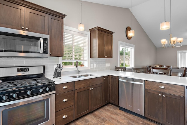17051 Lupine Ln, Big Lake, MN 55309 - kitchen featuring stainless steel appliances, a sink, plenty of natural light, lofted ceiling, and light countertops