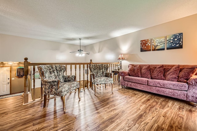 5959 373rd St, North Branch, MN 55056 - living room with wood finished floors, a ceiling fan, and a textured ceiling
