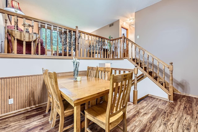 5959 373rd St, North Branch, MN 55056 - dining space with wood finished floors, stairway, and wood walls