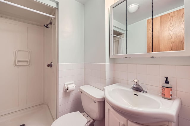 5959 373rd St, North Branch, MN 55056 - bathroom with a stall shower, vanity, tile walls, and wainscoting
