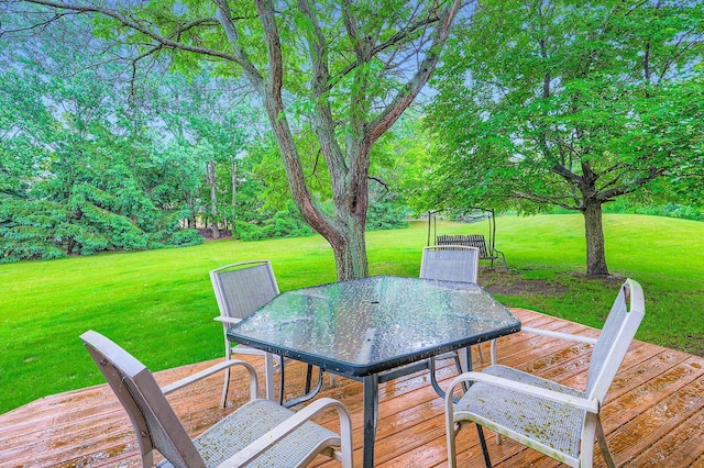 5959 373rd St, North Branch, MN 55056 - deck featuring outdoor dining area and a lawn