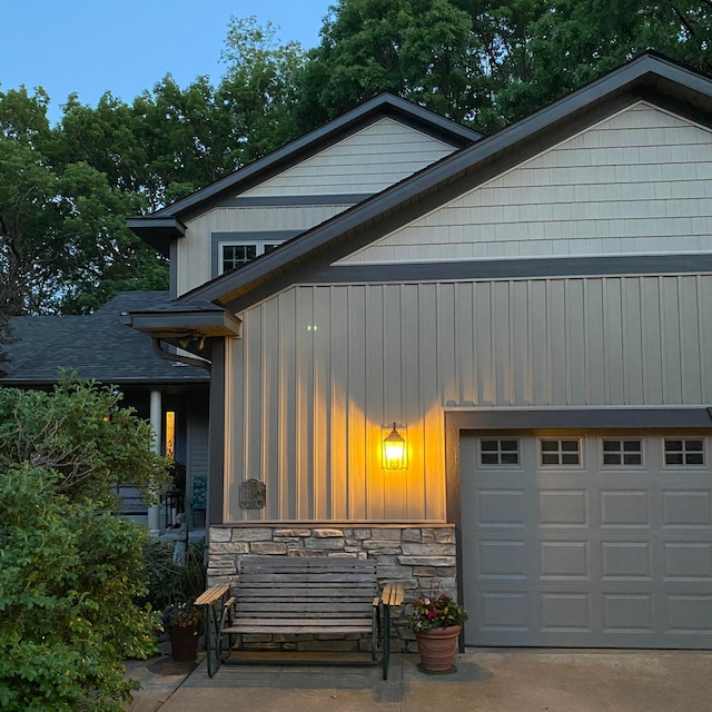 1110 Partridge Ln, North Hudson, WI 54016 - view of front of property with stone siding, board and batten siding, and driveway