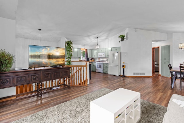 13610 Prairie Ct, Becker, MN 55308 - living area featuring lofted ceiling, dark wood-type flooring, and a chandelier