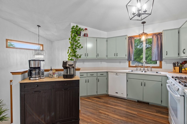13610 Prairie Ct, Becker, MN 55308 - kitchen featuring white appliances, lofted ceiling, a chandelier, dark wood-style flooring, and light countertops