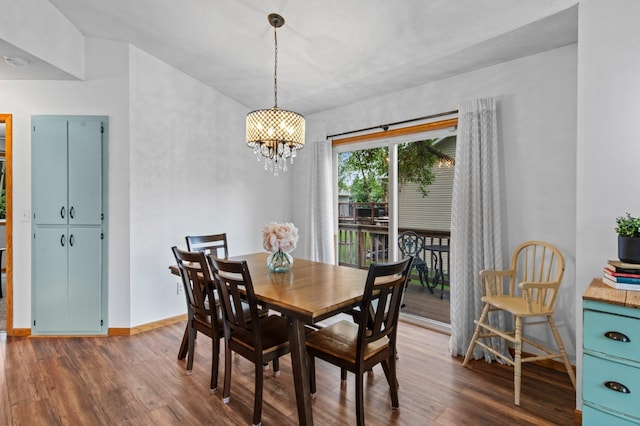 13610 Prairie Ct, Becker, MN 55308 - dining room with a chandelier and dark wood-style flooring