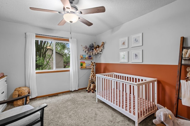 13610 Prairie Ct, Becker, MN 55308 - carpeted bedroom featuring a crib, a textured ceiling, and ceiling fan