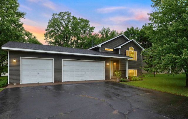 13610 Prairie Ct, Becker, MN 55308 - traditional home with driveway, a front yard, and an attached garage
