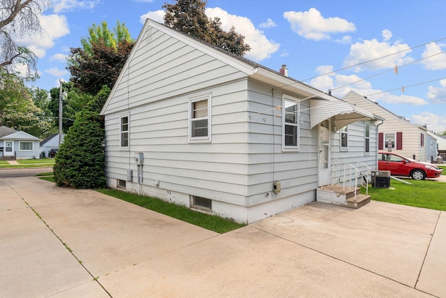 1306 6th Ave NW, Austin, MN 55912 - view of property exterior with a central AC unit and a patio area